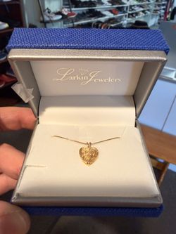 14k 2.5g Yellow Gold & Diamond Heart Pendant Necklace,  featuring textured gold and two small diamonds. 18” Box Chain