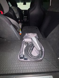 Tesla mobile charger 110v 250v adapters included.