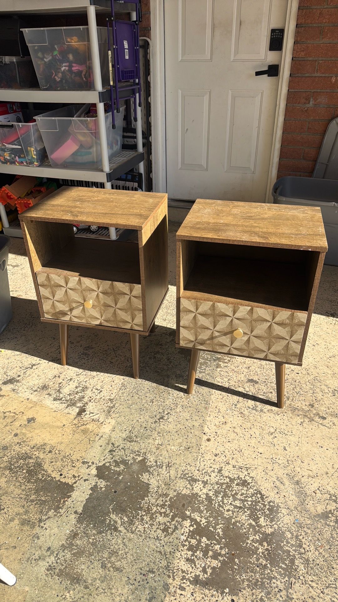 Oak veneer with gold handles. One table has small damage but other than that, good shape.