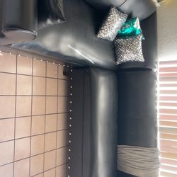 Black leather sectional couch