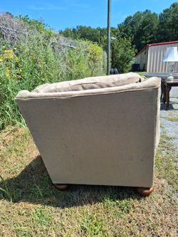 Tan Upholstered Arm chair with Wood Feet