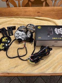 KC SlimLite LED 4 inch off road light. Each light is 42 W with a spot beam pattern lights are in mint condition.