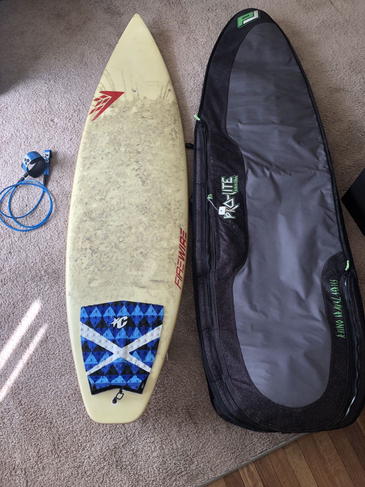 FireWire surfboard 6’6”. With leash and bag