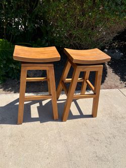 Pair of wood swivel bar stools, 30 inch