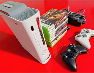 Microsoft Xbox 360 with 2 controllers 12 games HDMI cord power supply