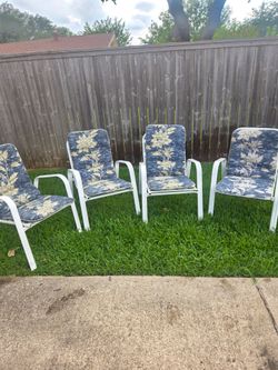 4 Outside Patio Chairs with removable pads. Very good condition.