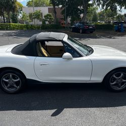 2000 Mazda Miata 1.8 Liter  Automatic Cold a/c New tires (4) New top with glass window New battery Wrap, carbon fiber, side spoilers Fun little car ex