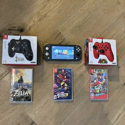 Nintendo Switch Lite With Games And Controllers