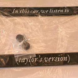  "In this car, we listen to (taylor's version)" black metal license plate frame. 