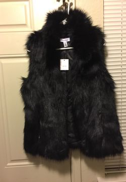 Faux fur Calvin Klein vest new tags on zipper pockets no buttons or hooks