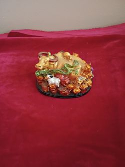 Feng shui wish fulfilling cow with coins