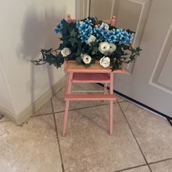 Floral Arrangement In Vintage Baby Doll High Chair 