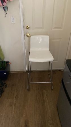 One white barstool chair