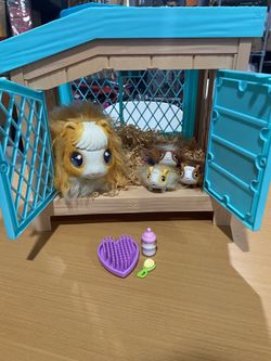 Needs batteries   Mama Surprise | Soft, Interactive Mama Guinea Pig and her Hutch, and her 3 Surprise Babies, 20+ S