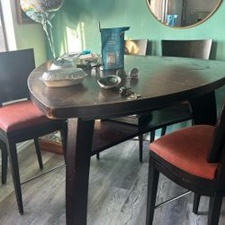 High table with four chairs