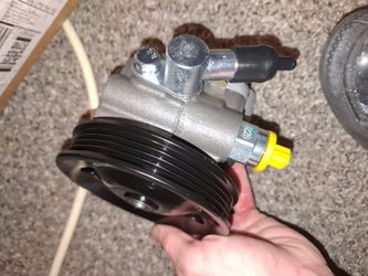 ECCPP or A-Premium power steering pump, specifically designed with a black pulley for vehicles like the 2002-2006 Toyota Camry or Lexus ES300/ES330.