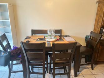 GE refrigerator,  dining room table, dresser