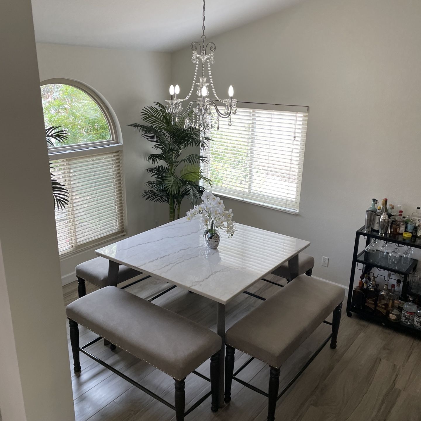 Counter height kitchen table with stone top with 4 benches 