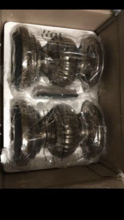 Gold and bronze set of lit candle pillars