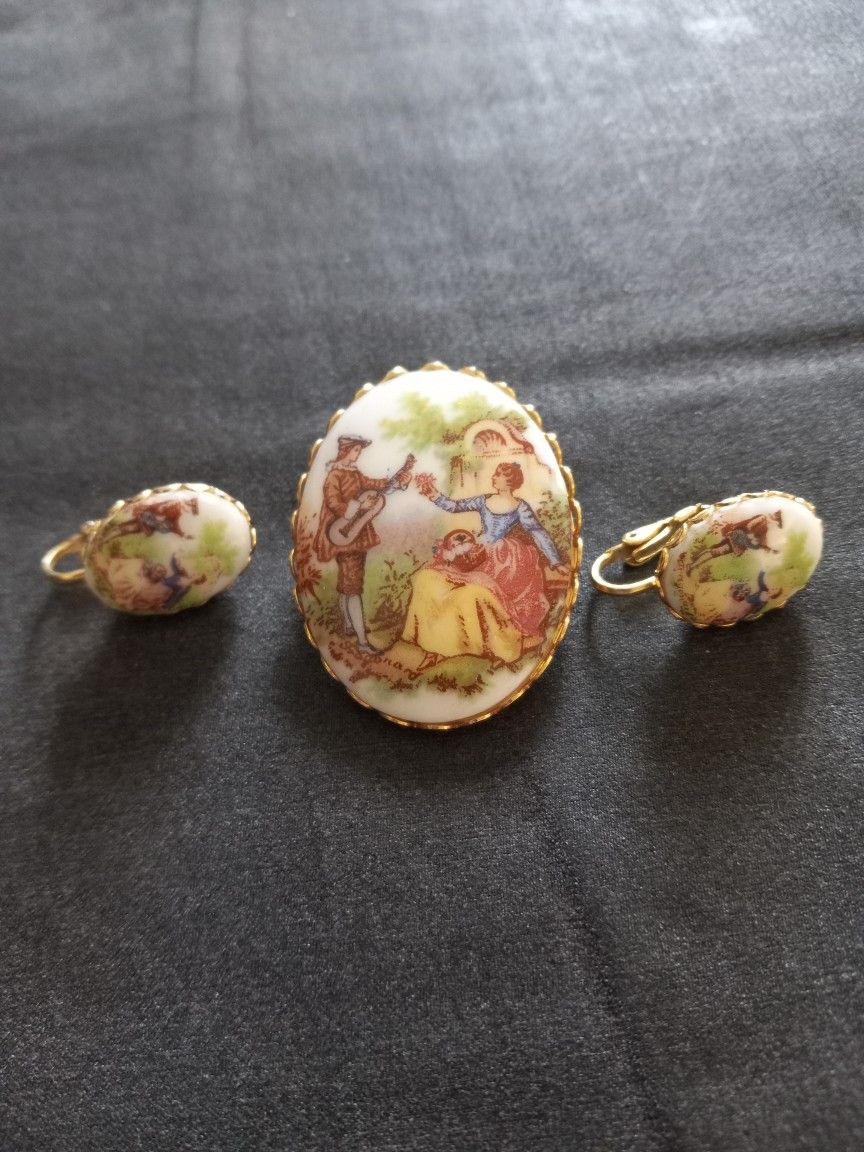 Renaissance Musical Scene Porcelain Brooch With Matching Earrings 1950s Era Cute. No cracks. Ornate trim. Clip on earrings with working clasps. Matchi