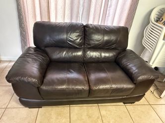 $100 leather loveseat couch