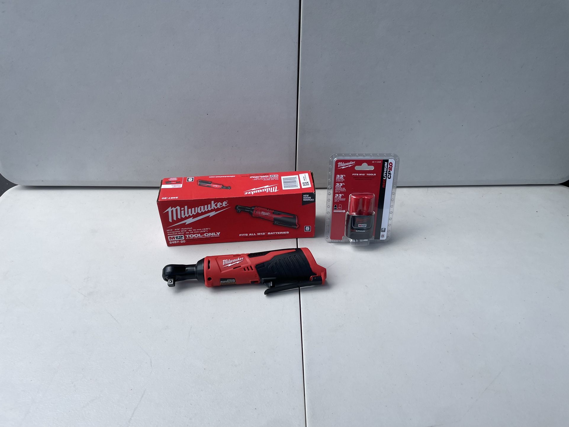 Milwaukee M12 Ratchet 3/8 Model 2357-20 And Battery M12 CP 2.0 Model 48-11-2420