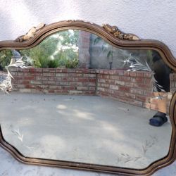  An Antique Oval Shaped Overmantel Mirror