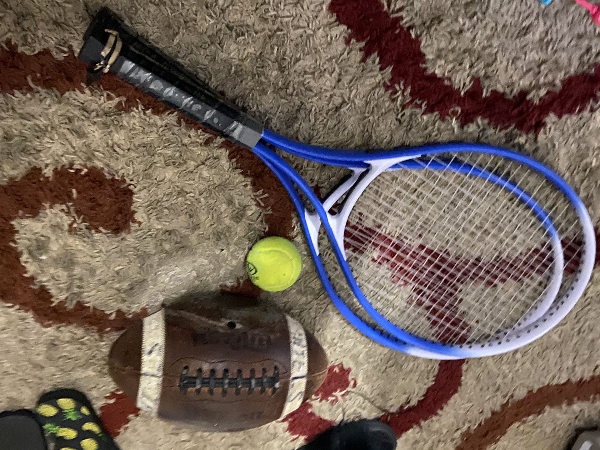 Tennis rackets and football and tennis ball