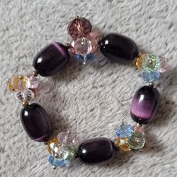 Beaded Stretch Bracelet With Purple Glass " Cat's Eyes " Beads And Multicolored Crystal-like Beads.