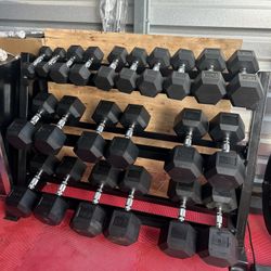 New pair of 5,10,15,20,25,35,40,45,50, 55,60lb rubber dumbbells + rack. All new in box $820