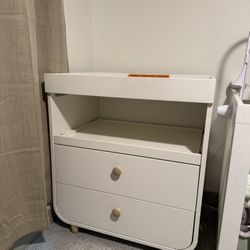IKEA changing table with large drawers.