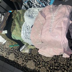 various Pakistani or Indian salwar kameez suits featuring embroidery and organza fabric Size m