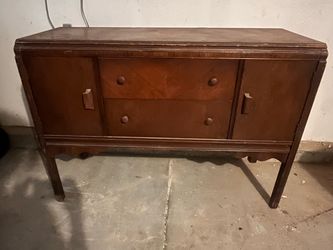 Vintage solid wood buffet/sideboard with drawers and cabinet storage.