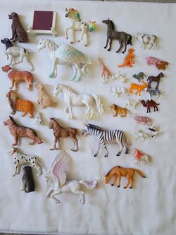 A variety of small plastic animals for boys and girls.