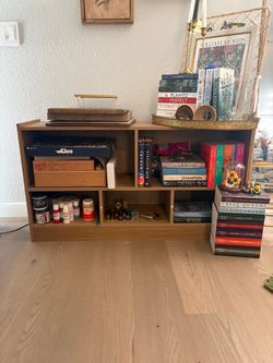 EVERYTHING MUST GO. wooden bookshelf, like new, five compartments, easy to move.