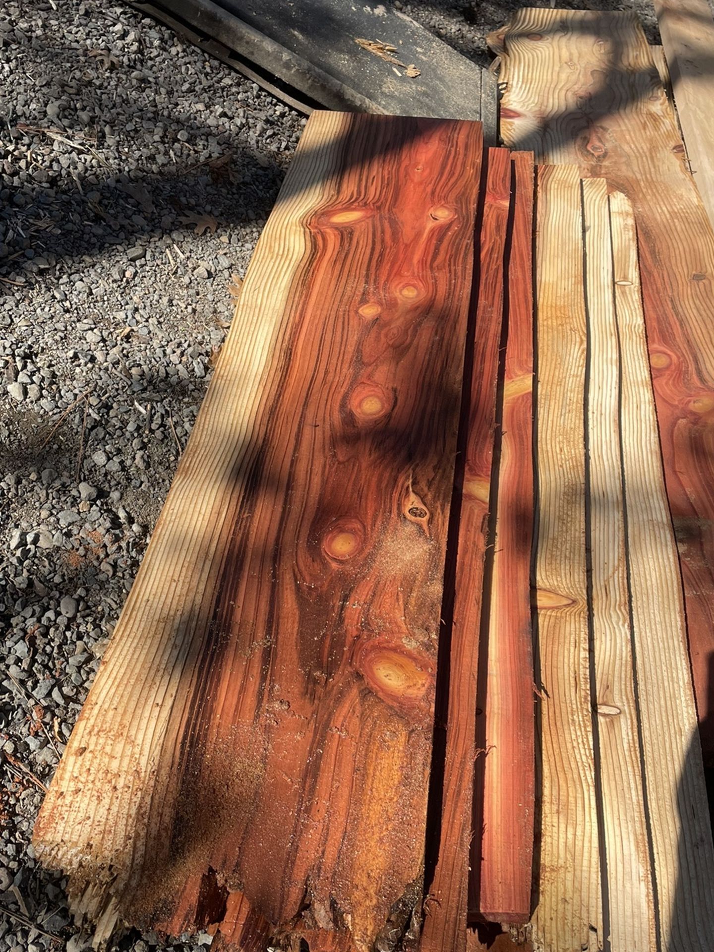 Stack Of Redwood And Cedar Boards And Live Edge Planks