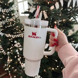 Stanley Just Released a New Holiday Tumbler With a Candy Cane Decorated  Straw