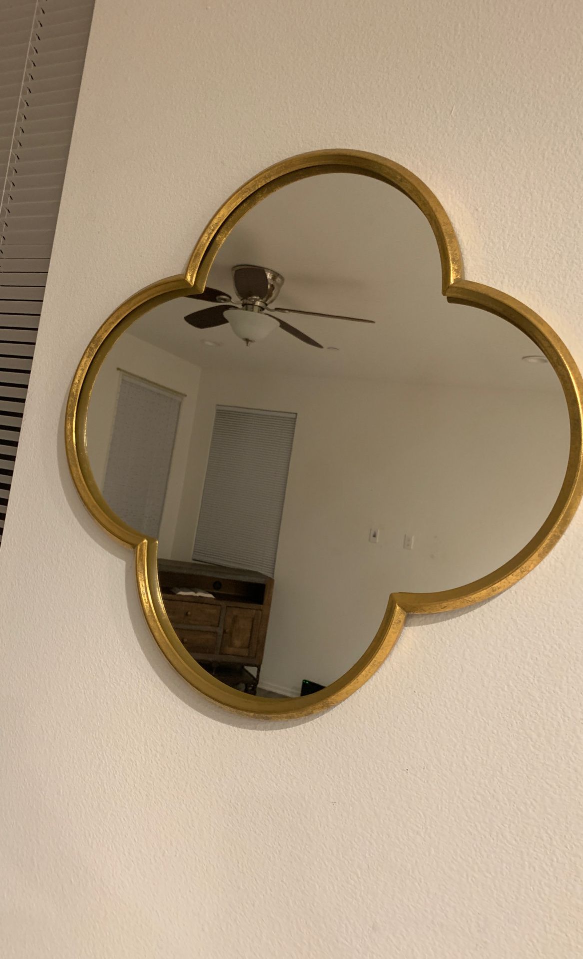 Two gold wall mirrors