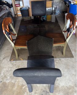 Tempered glass dining table. With two Chairs from the original set of four.
