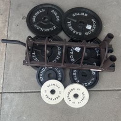 250lbs of Olympic weights with weights tree