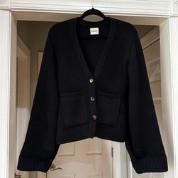 Khaite Scarlet Cardigan in black.