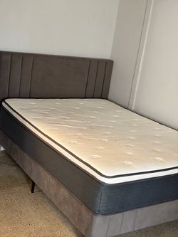 Full size bed with mattress, boxspring, frame, and headboard