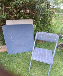 Blue folding chair w card table