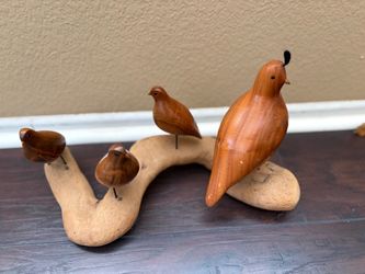Carved Wooden Bird Figurines on Driftwood