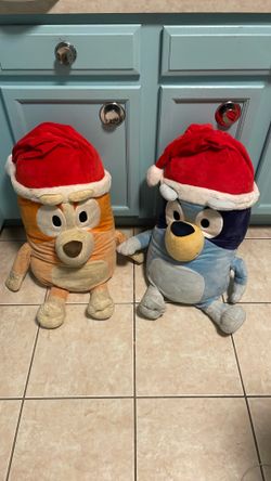 Two large plush Bluey and Bingo Santa’s