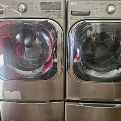 LG 5.2 cu. Ft. Mega capacity front load  washer and 9.0 cu. Ft. Mega capacity electric dryer with built-in intelligence with storage pedestal