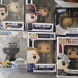 This image features a collection of collectible vinyl figures, including Funko Pop! branded boxes for Gotham characters Harvey Bullock and James Gordo