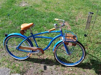 This is a metallic blue Huffy 26" Cape Cod Men's Cruiser Bike