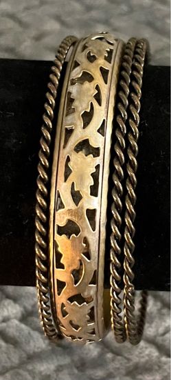 four-piece vintage-style metallic bangle stack