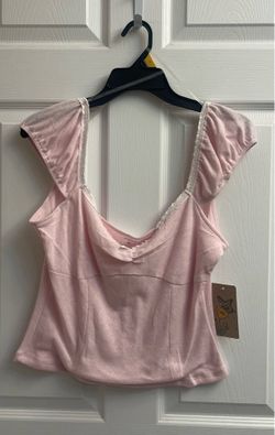 Brand new Juniors light pink/white trim tops sizes L & XL $5.00 each